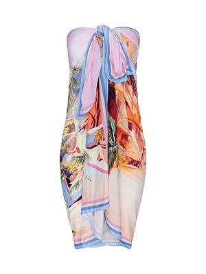 The Maribel Cover-Up Pareo is a strapless beach dress with a vibrant tropical postcard print, showcasing palm trees, buildings, and blue-trimmed edges. It ties in a knot at the bust for a stylish look.