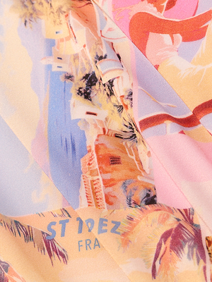 The Vanessa High-Waisted Bikini Bottom features a vibrant, abstract pastel print of a coastal town with palm trees, buildings, and the text ST DEZ FRA—perfect for postcard-inspired swimwear.