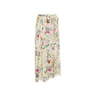 The Klaire Cover-Up Skirt is a long, flowy wrap maxi skirt with a white background adorned with a vibrant floral and butterfly print. Crafted from lightweight viscose chiffon, it features a gathered, tied waistband and offers a relaxed, draped fit.