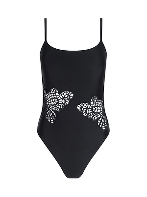 The Remi One-Piece Swimsuit is a black maillot with thin shoulder straps and butterfly-shaped lace cutouts at the waist, removable cups, shown on a white background.