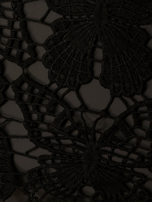 Close-up of the Janus Cover-Up Robe’s black lace fabric, showcasing an intricate butterfly crochet pattern and a semi-sheer effect—ideal for a bohemian beach coverup or maxi dress against a dark background.