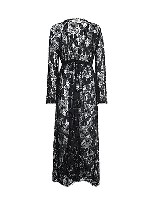 The Janus Cover-Up Robe is a black, long-sleeve lace maxi beach dress with a floral pattern, cinched waist, and ankle-length hem. Sheer and elegant, this bohemian piece is perfect as a swim coverup. Displayed on a plain white background.