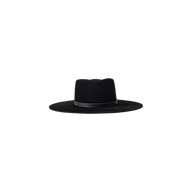 The Reyes Leather Band Fedora features a black felt wide brim, a flat crown, and is accented with a sleek black leather band, shown against a plain white background.
