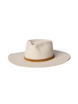 The Reyes Leather Band Fedora is a wide-brimmed, light beige felt hat handcrafted in LA, featuring a brown leather band around the crown, shown against a white background.
