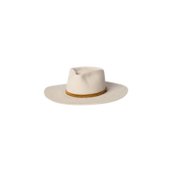 The Reyes Leather Band Fedora by Gladys Tamez Millinery is a wide-brimmed, off-white felt hat featuring a light brown leather band around the base of the crown, displayed against a plain white background. This handcrafted piece exemplifies refined elegance and exceptional artisanal quality.