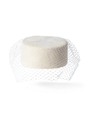 A white Anstine Pillbox Hat, round and wrapped in a loose, translucent net like a birdcage veil, displayed against a plain white background.