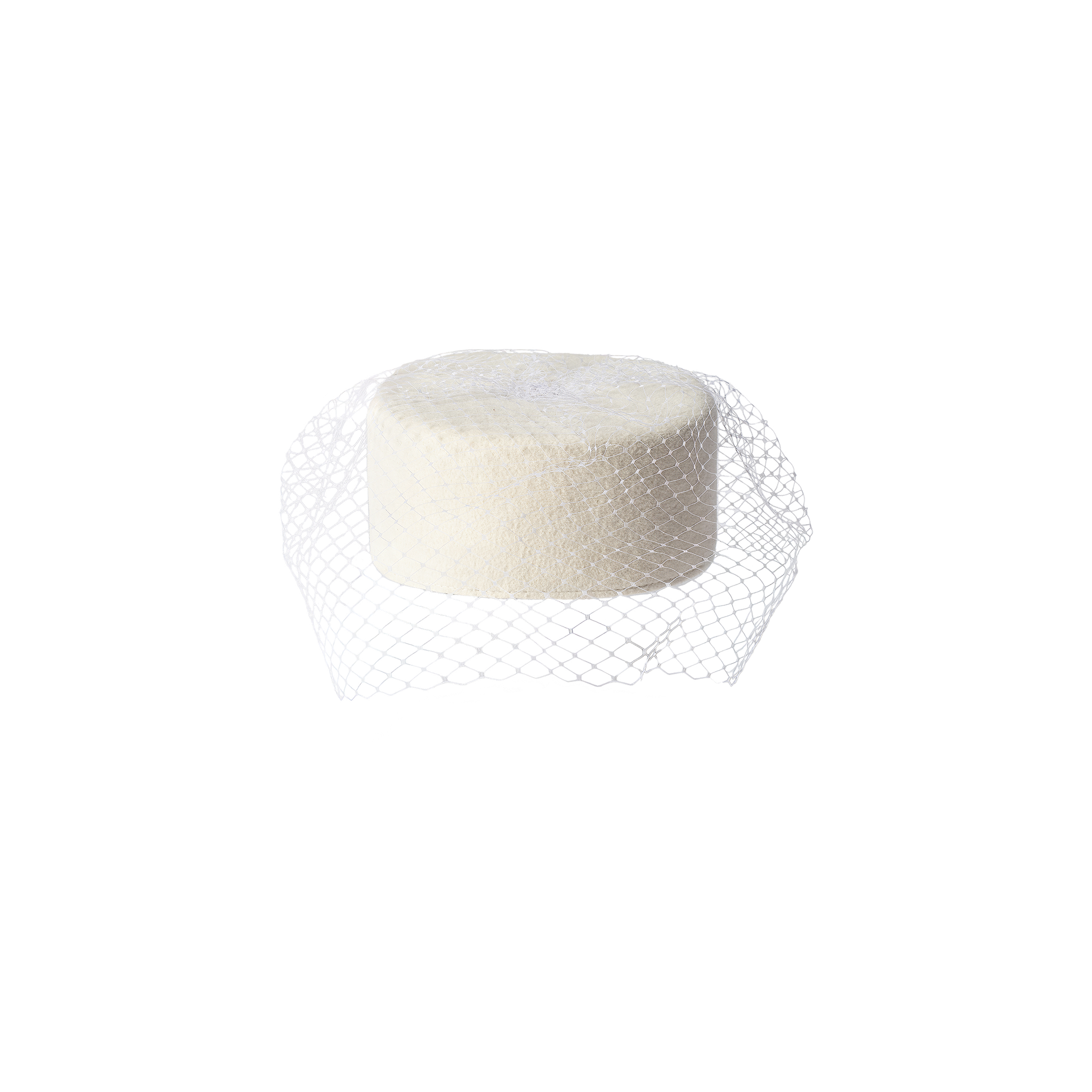 The Anstine Pillbox Hat, a round, off-white accessory, sits upright on a white background, partially wrapped in white mesh netting reminiscent of a birdcage veil.
