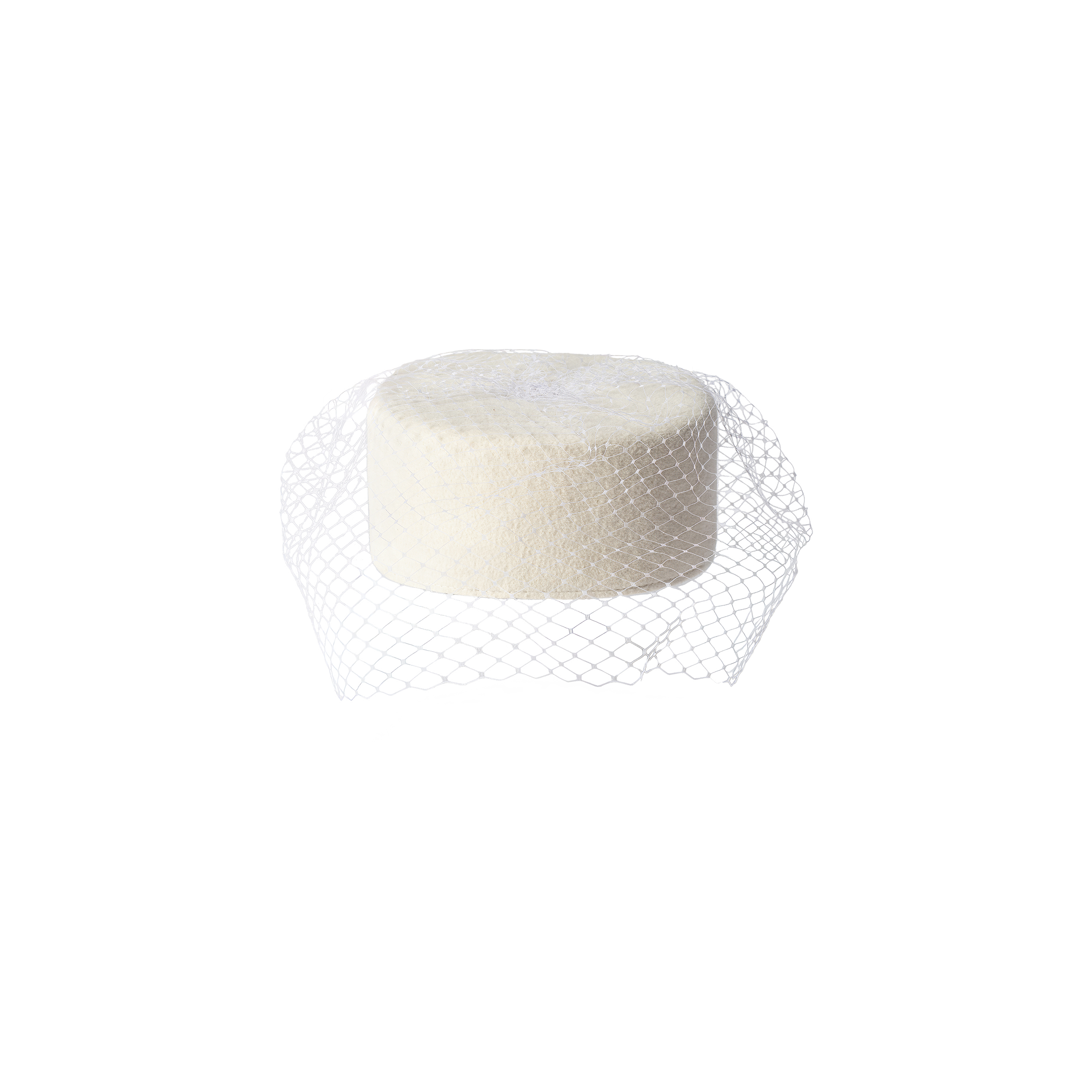 The Anstine Pillbox Hat, a round, off-white accessory, sits upright on a white background, partially wrapped in white mesh netting reminiscent of a birdcage veil.
