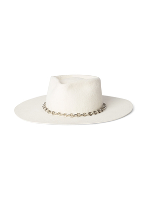 The Umbra Hat is a handcrafted white felt hat with a wide brim and flat crown, beautifully finished with a silver chain accent around the base.