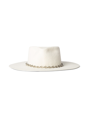 The Umbra Hat is a handcrafted wide brim hat made of white felt, featuring a silver chain band around the crown. It is displayed on a plain white background.