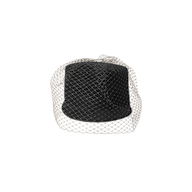 The Rawle Mini Cap—a black velvet pillbox hat featuring a delicate black veil elegantly draped over it—is displayed on a plain white background.