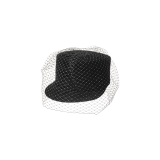 The Rawle Mini Cap is a black vintage-style mini cap with a short brim, crafted from luxurious felt velour and elegantly covered by a delicate black veil, set against a plain white background.