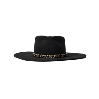 Ferrante Hat by Gladys Tamez Millinery—a wide-brimmed black felt design highlighted by a striking gold chain band around the base of the crown, showcased against a plain white background.