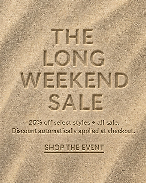 Text in sand reads: The Long Weekend Sale. 25 off select styles + all sale. Discount automatically applied at checkout. Shop the event. The background looks like smooth, sunlit sand dunes.