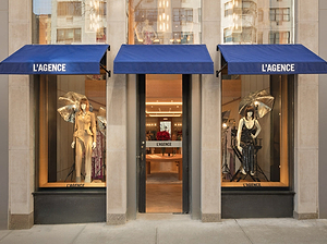 L'AGENCE store front with mannequins and fashion displays.