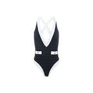 The Lisa Plunge One-Piece Swimsuit features a black textured bouclé fabric, a deep V-neckline with white trim, criss-cross back straps, and two decorative buttons at the waist. Designed for moderate bottom coverage, this swimsuit blends modern elegance with a flattering silhouette.