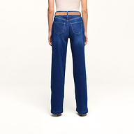 A person is standing facing away, wearing the Petite Scottie Wide-Leg Jean in blue, featuring back pockets and crafted from stretch denim, paired with a light-colored top against a plain white background.