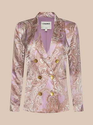 The Colin Silk Blazer by L’AGENCE features a pink and gold paisley print, gold buttons, and a double-breasted silhouette in silk charmeuse, shown on a beige background.