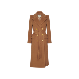 The Kolina Long Coat is a long, camel-colored power coat featuring gold buttons, wide lapels, a fabric belt, flap pockets, and a tailored fit, displayed on a plain white background.