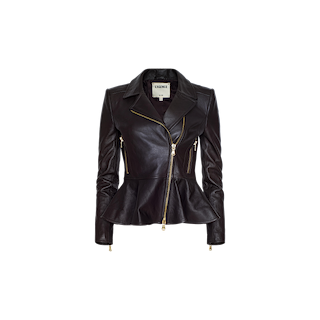 The Lyric Leather Peplum Jacket, crafted from black lambskin leather, features gold zippers, a notched collar, long sleeves, a fitted waist, and a peplum hem, shown against a plain white background.