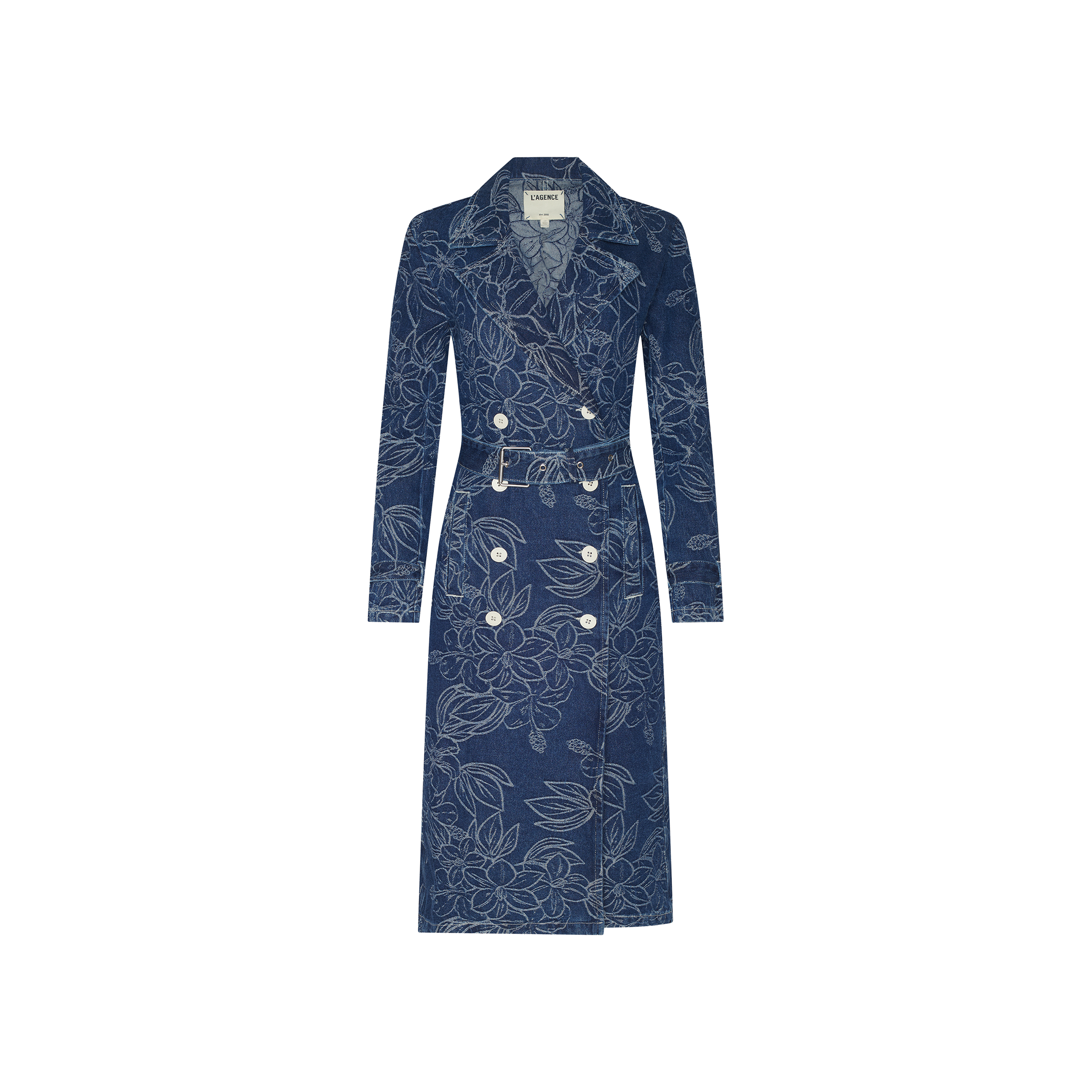 The Bradley Trench Coat is a long blue floral jacquard denim trench coat featuring a double-breasted front, wide collar, button details, waist belt, and long sleeves, displayed on a plain white background.