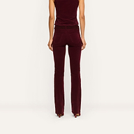 Back view of a person wearing fitted burgundy high-rise stretch corduroy Saffia Corduroy Pant and a matching sleeveless top.