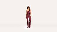 A woman wearing a dark red lace camisole, a belt with a gold buckle, and matching dark red trousers.