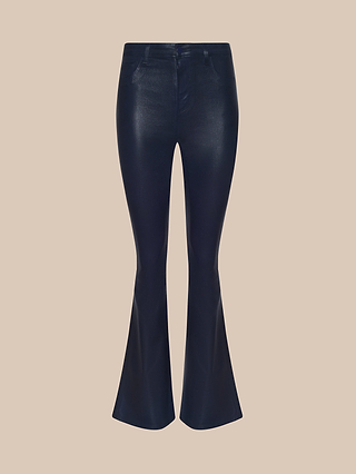 The Marty Coated Flare Jean, shown in dark blue coated denim with a shiny finish against a plain beige background, features belt loops, front pockets, and a fitted silhouette through the thighs that extends into a stylish flared hem.