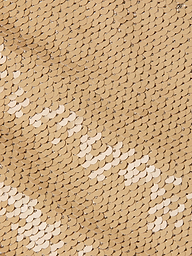Close-up of overlapping gold sequins arranged in a uniform pattern, creating a shiny, textured surface reminiscent of the Gavin Sequin Wide-Leg Pant, with varying light reflections.