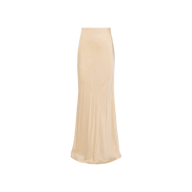 The Zeta Satin Maxi Skirt is a long, high-waisted piece in a champagne hue with a smooth, shiny finish and a slight flare at the hem, creating an elegant maxi silhouette against a plain white background.