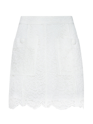 The Riven Lace Mini Skirt is a white A-line skirt with pockets, offering a classic silhouette perfect for any occasion.