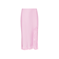 The Tico Silk Lace Skirt, a light pink high-waisted midi skirt, features delicate eyelash lace trim along the hem and side, displayed on a plain white background.