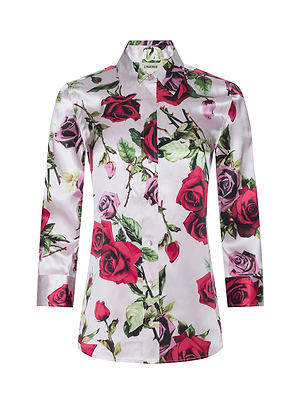 The Dani Silk Blouse is a long-sleeved, collared button-down featuring a vibrant red and pink rose print on a light silk background.