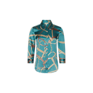 The Dani Silk Blouse is a teal satin silk top adorned with a gold and beige chain and belt print, featuring a classic collar and long sleeves, shown against a plain white background.