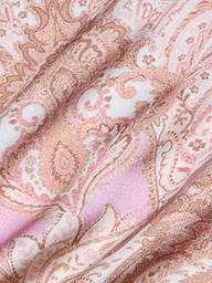Close-up of the Lexi Silk Camisole in pink, beige, and cream paisley-patterned bias-cut silk fabric, featuring soft folds and a subtle sheen.