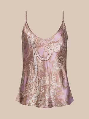 La canotta Lexi Silk è un top di seta senza maniche con spalline regolabili e un motivo paisley rosa e beige su sfondo beige chiaro.