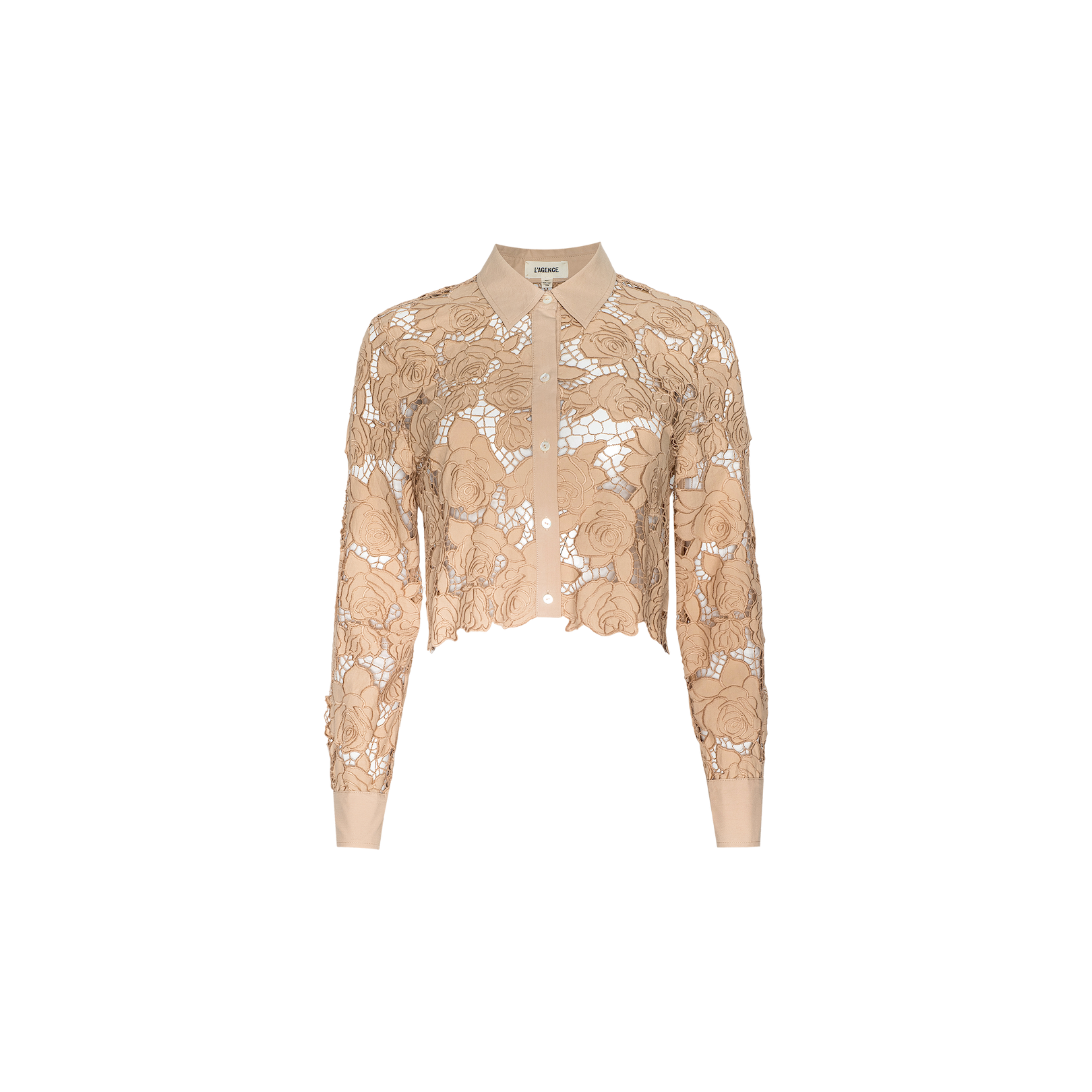 The Seychelle Cropped Eyelet Blouse is a beige, long-sleeve top featuring a collared neckline, button front, and intricate floral lace detailing over sheer fabric, finished with a cropped silhouette and shown against a plain white background.