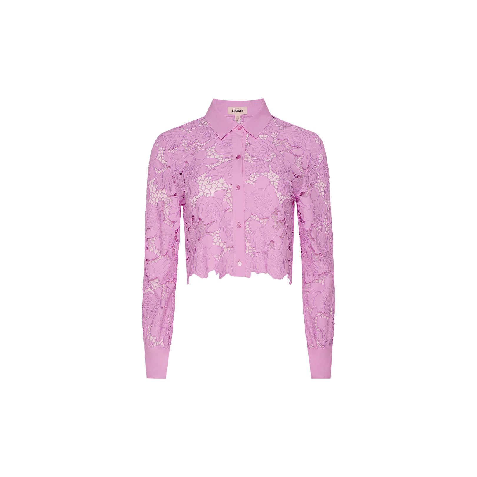 The Seychelle Cropped Eyelet Blouse is a long-sleeve, light purple lace blouse with a collar and button-down front, featuring a cropped hem and delicate floral patterns reminiscent of styles seen in Legally Blonde.