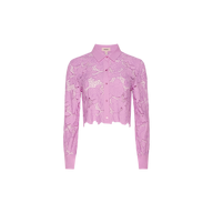 The Seychelle Cropped Eyelet Blouse is a long-sleeve, light purple lace blouse with a collar and button-down front, featuring a cropped hem and delicate floral patterns reminiscent of styles seen in Legally Blonde.