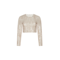 The Rogan Sequin Top is a long-sleeve crop top, perfect for parties, featuring light beige champagne sequins and shown against a plain white background.
