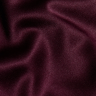 Close-up of smooth, deep burgundy fabric with soft folds and a subtle sheen, highlighting the luxurious and elegant appearance of the Dara Stretch-Satin Bodysuit with adjustable straps.