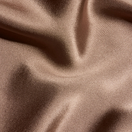 Close-up of the brown Orlina Silk Camisole, featuring gathered, lustrous fabric and soft folds.