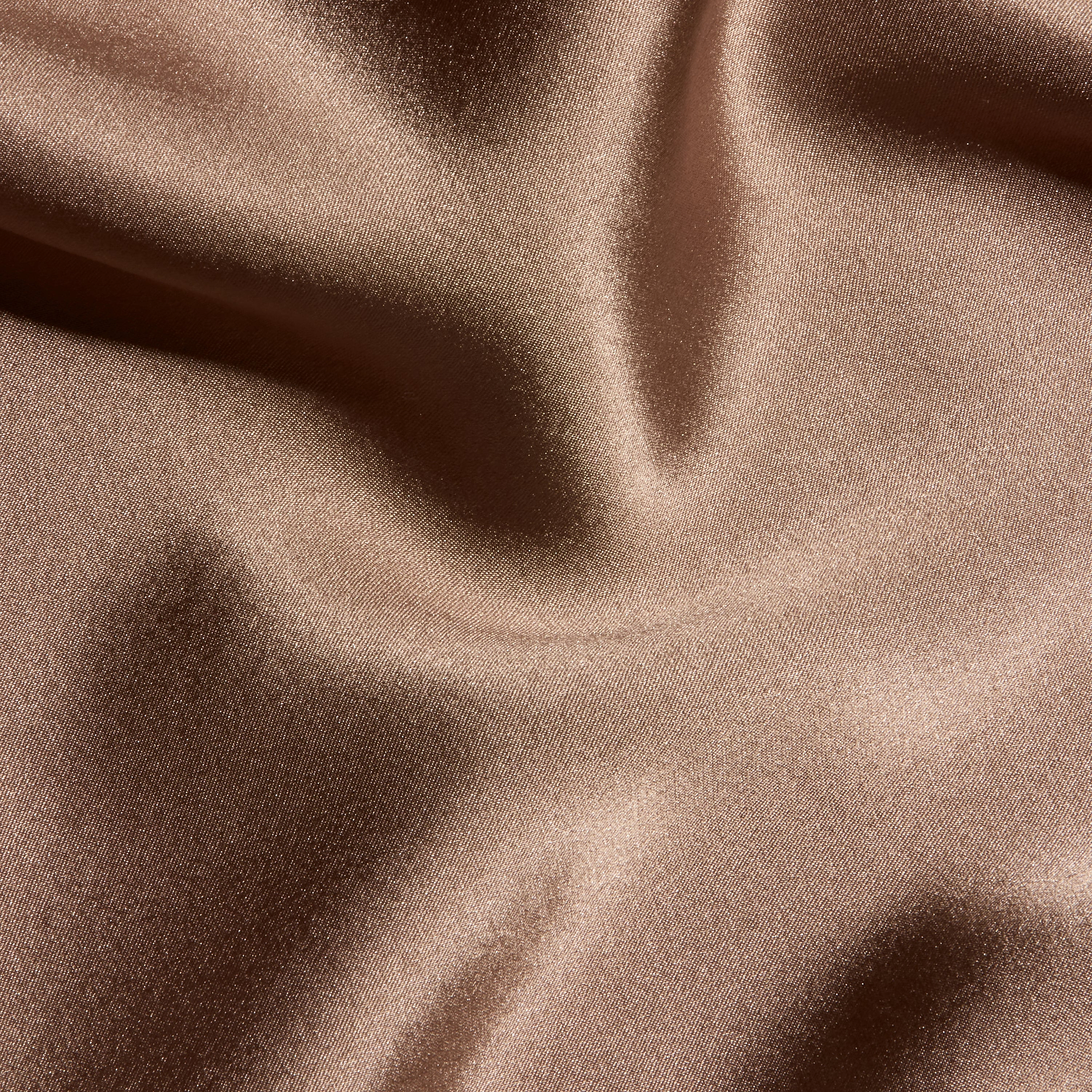 Close-up of the brown Orlina Silk Camisole, featuring gathered, lustrous fabric and soft folds.