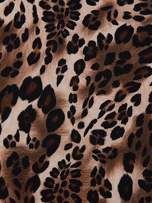 A close-up of the Ceci Sleeveless Turtleneck by L'AGENCE, featuring ultra-soft jersey fabric in a leopard print with black and dark brown spots on a light brown background for a chic, animal-inspired look.