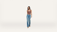 A woman wearing a brown tank top, blue flared jeans, and sandals walks forward against a plain white background.
