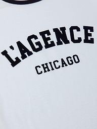 Introducing the Tommie Crewneck Tee—a relaxed fit white ringer tee featuring “LAGENCE CHICAGO” boldly printed across the front. Crafted from premium Supima cotton for exceptional comfort.