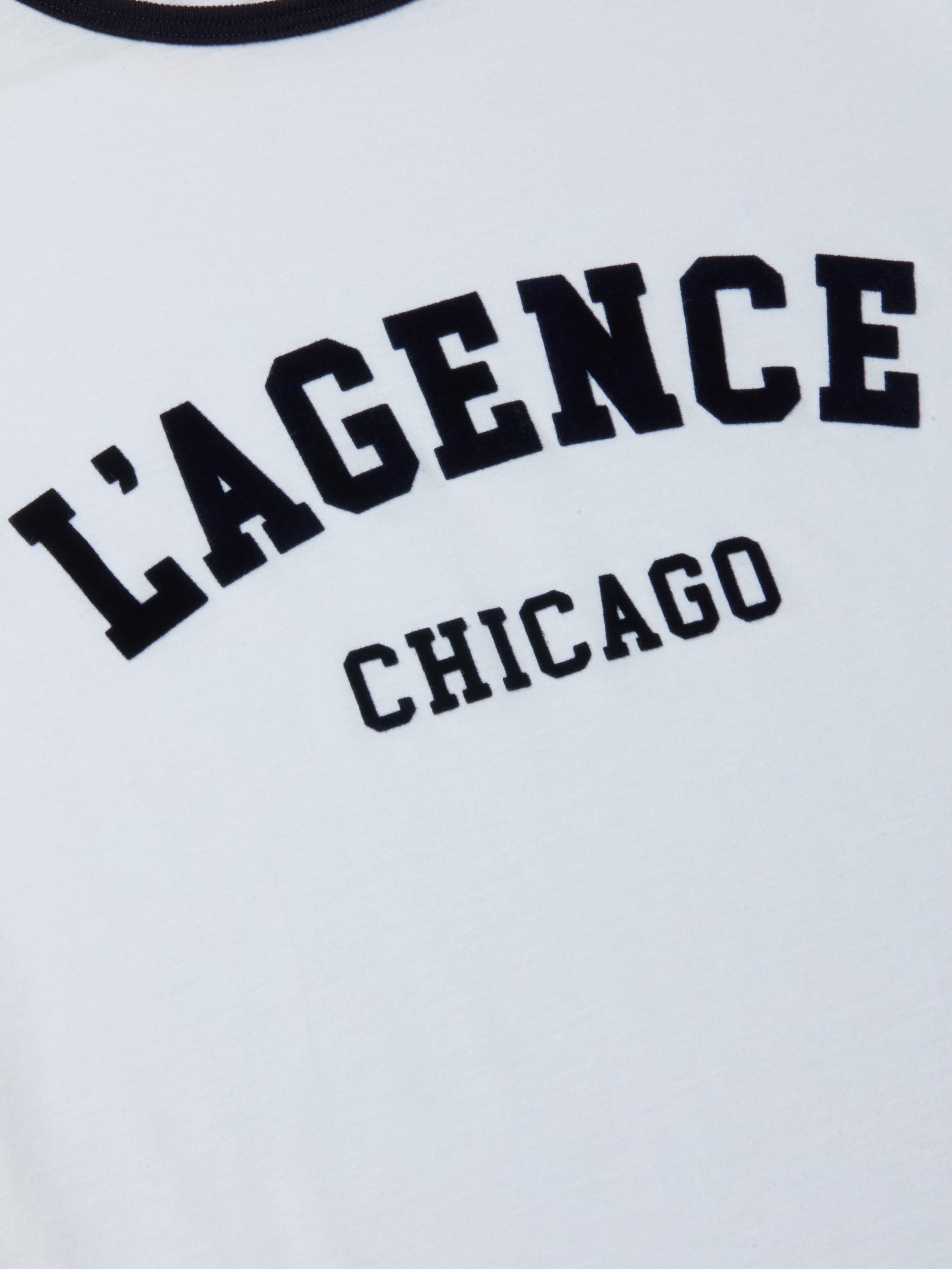 Introducing the Tommie Crewneck Tee—a relaxed fit white ringer tee featuring “LAGENCE CHICAGO” boldly printed across the front. Crafted from premium Supima cotton for exceptional comfort.