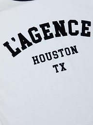 The Tommie Crewneck Tee is a white Houston t-shirt featuring bold black “LAGENCE” lettering above smaller “HOUSTON TX” text, crafted from soft Supima cotton in a relaxed fit.