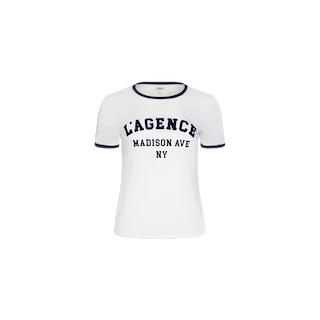 The Tommie Crewneck Tee is a white short-sleeve ringer t-shirt with black trim on the sleeves and collar, featuring the text “LAGENCE MADISON AVE NY” in bold black letters on the front.