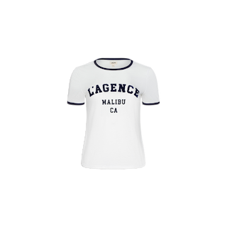 Introducing the Tommie Crewneck Tee—a white, short-sleeve ringer t-shirt with contrasting black trim on the collar and sleeves. The front proudly displays “LAGENCE MALIBU CA” in bold black lettering. Made from breathable Supima cotton, this relaxed-fit tee ensures all-day comfort and effortless style.